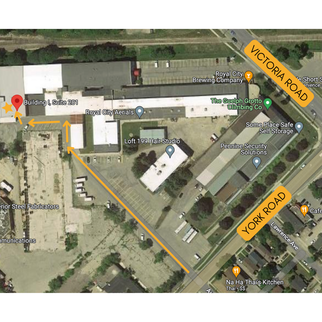 Birds-eye view of a building area. On the top right, the road is labelled Victoria Road. On the bottom right, the road is labelled York Road. Arrows lead from York road, to the back of Building i, suite 201.