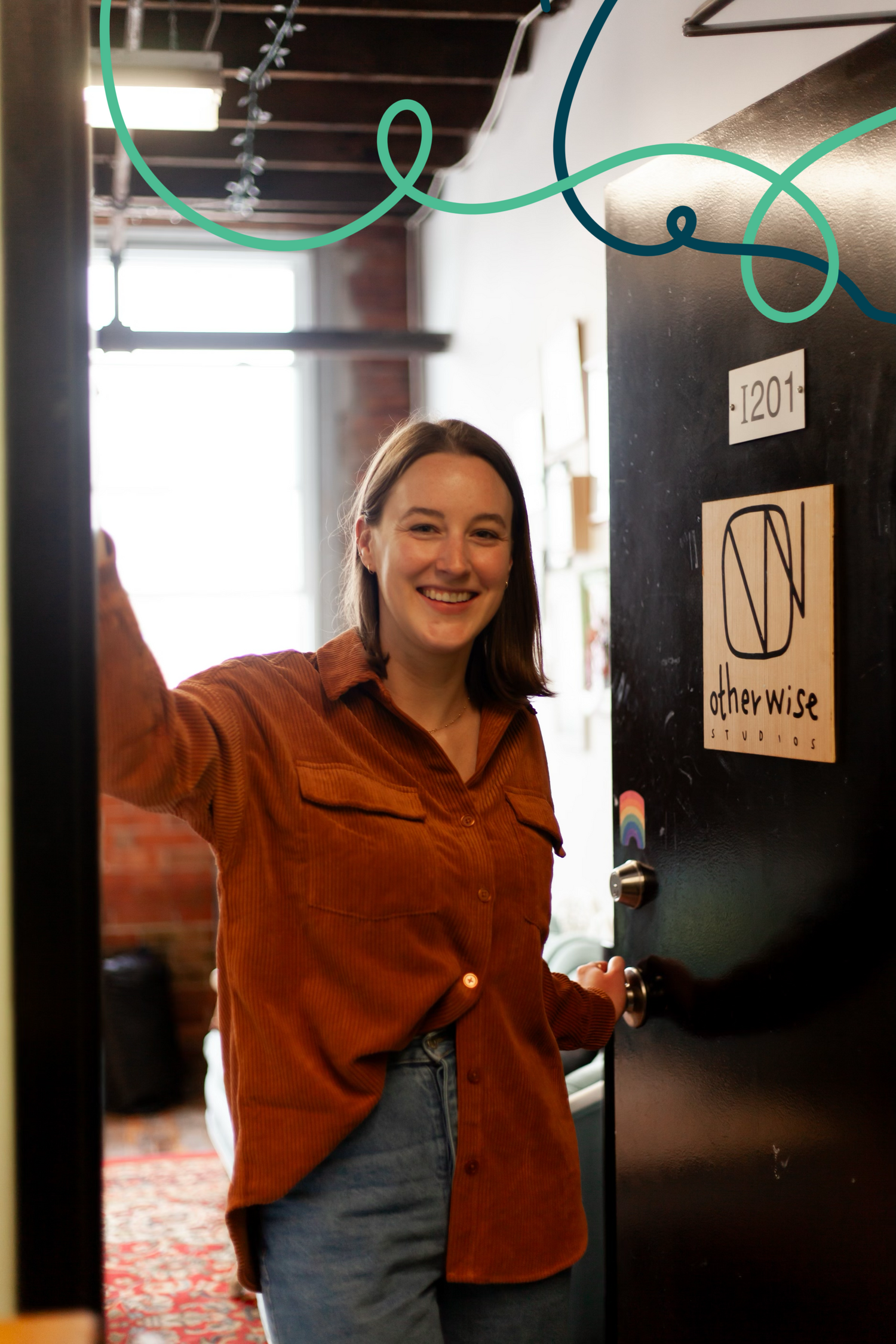 Person wearing an orange corduroy shirt smiles, holding a door open that has an Otherwise Studios sign on it. Turquoise and navy blue curvy lines decorate the top of the picture.